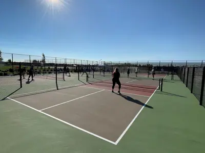 Legacy Pickleball courts sunny people playing pickleball