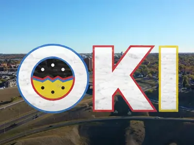 Oki logo over Landscape skyline