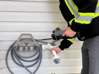 water meter check by employee garden hose reel