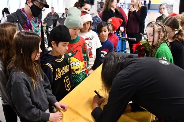 Winter Solstice signing autograph with children