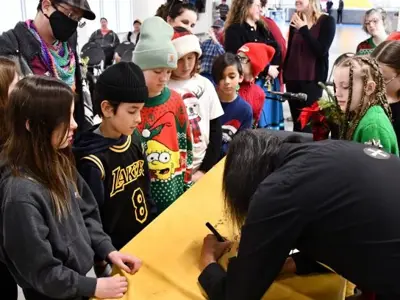 Winter Solstice signing autograph with children