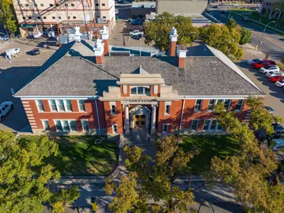 Bowman building drone view- surrounded by green trees