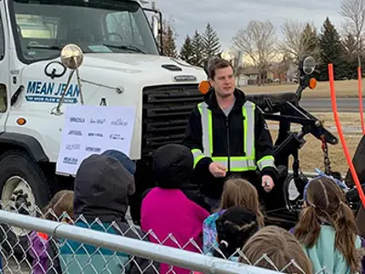 Snow Plow Mean Jean talking to students