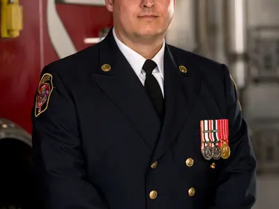 Troy Hicks Chief Fire Marshal 2024 in uniform Infront of truck