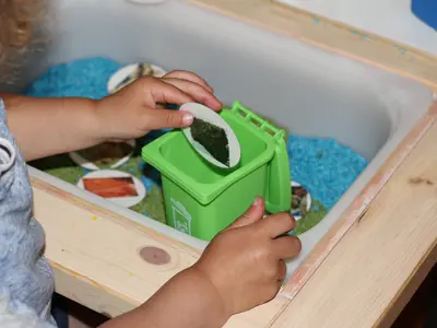 Toddler Oscar sorting organics 